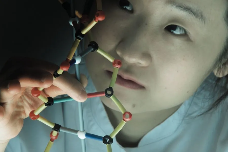 scientist holding molectular structure